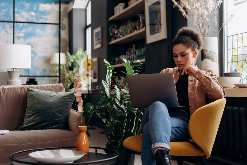 Image of a person carefully holding a laptop, illustrating the importance of proper laptop handling practices